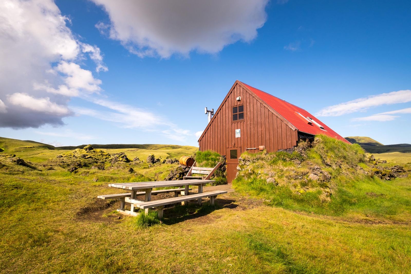 Icelandic mountain hut in summer landscape