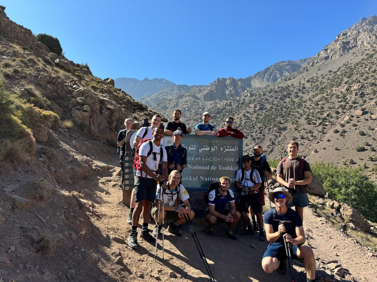 Mount Toubkal Trek - Hikers outside of national park sign.