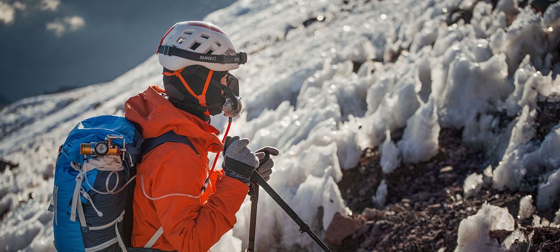 Climber using supplemental oxygen on Aconcagua summit push with ice formations