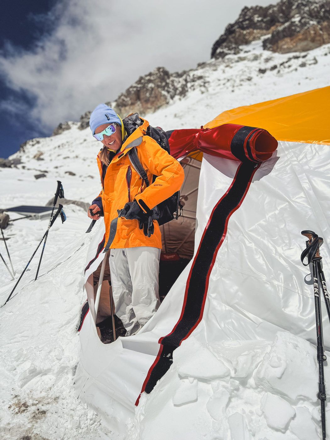 Climber near tent at snowy high camp on Aconcagua