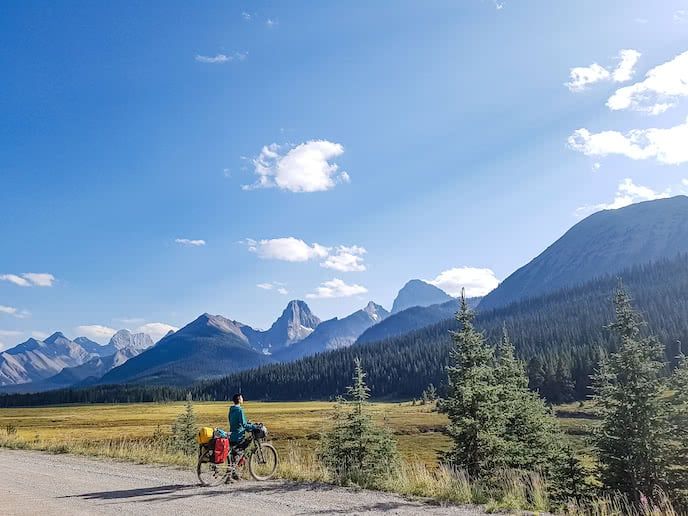 cycle tourist looking out with mountain bike