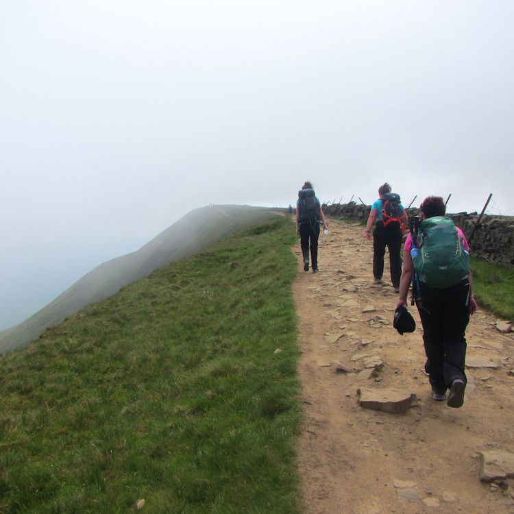 Happy hikers up into the mist