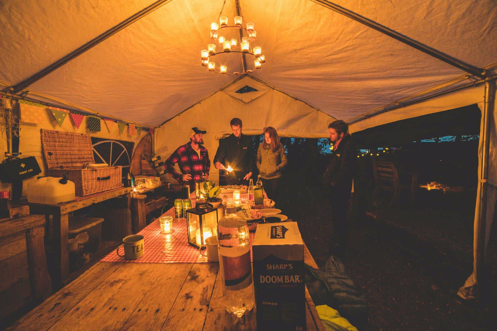 Surfing coasteering and wild camping - camp at night