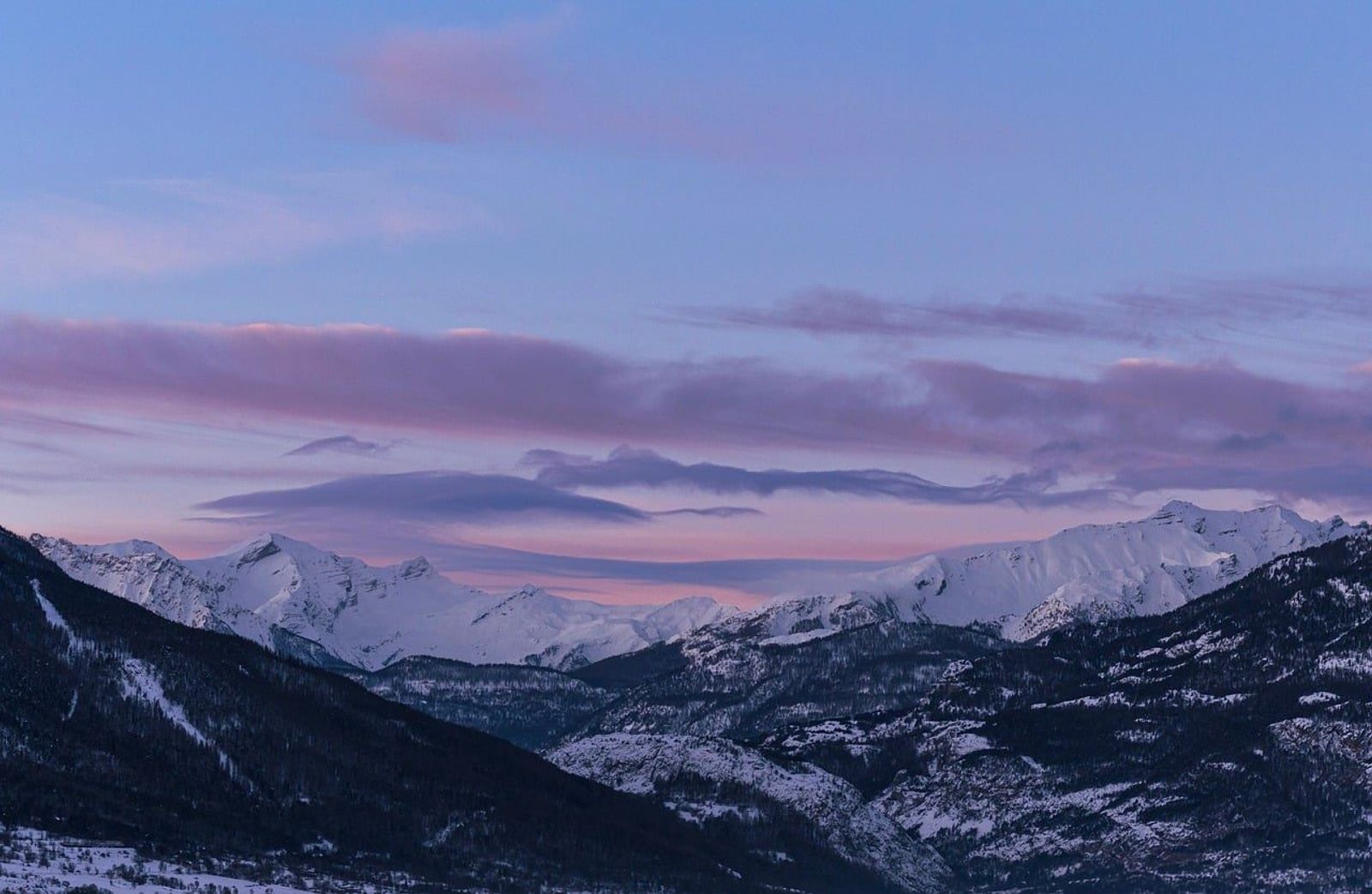 Dawn light over the snowy Alps