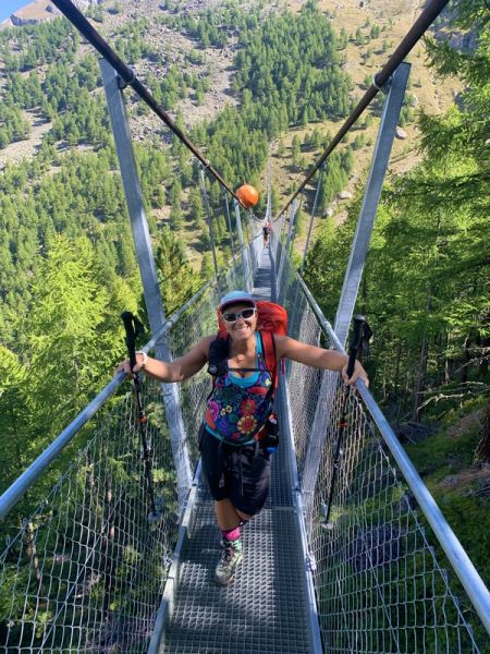 Hiker crossing the Charles Kuonen suspension bridge
