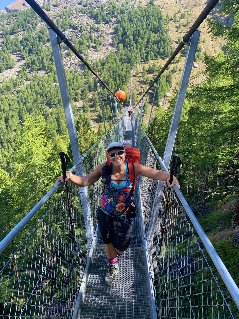 Hiker crossing the Charles Kuonen suspension bridge