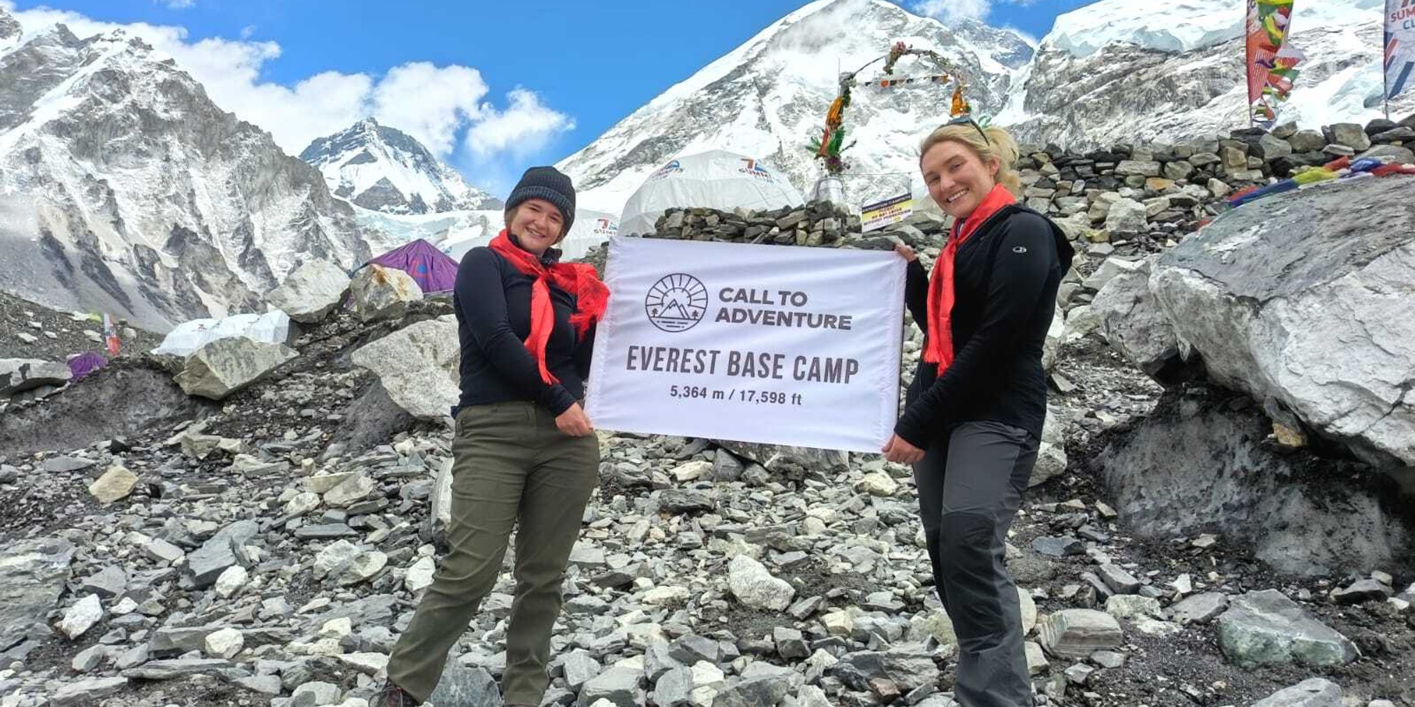 Trekker walking on the Everest Base Camp trail with high Himalayan peaks in the background