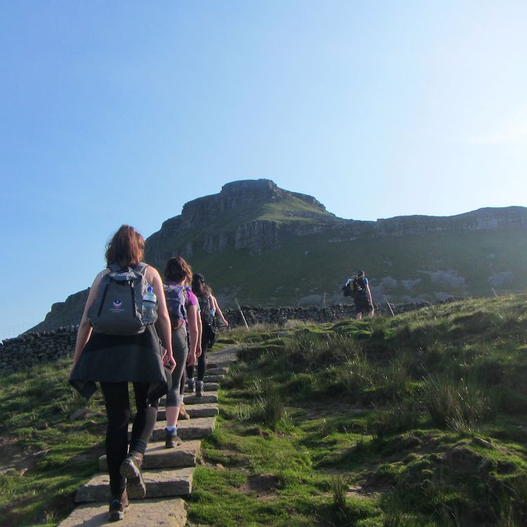 People walk up mountain