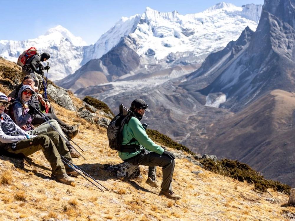 Expert guide leading a group in the mountains