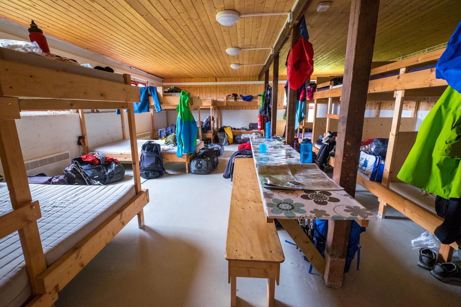 Mountain hut interior with camping gear