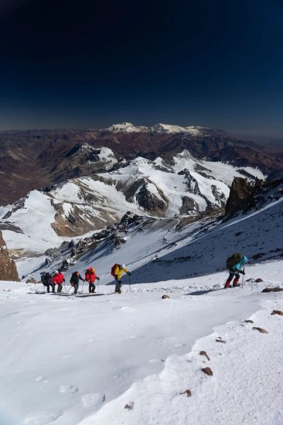 Mountaineers climbing through snow in the Andes on Aconcagua