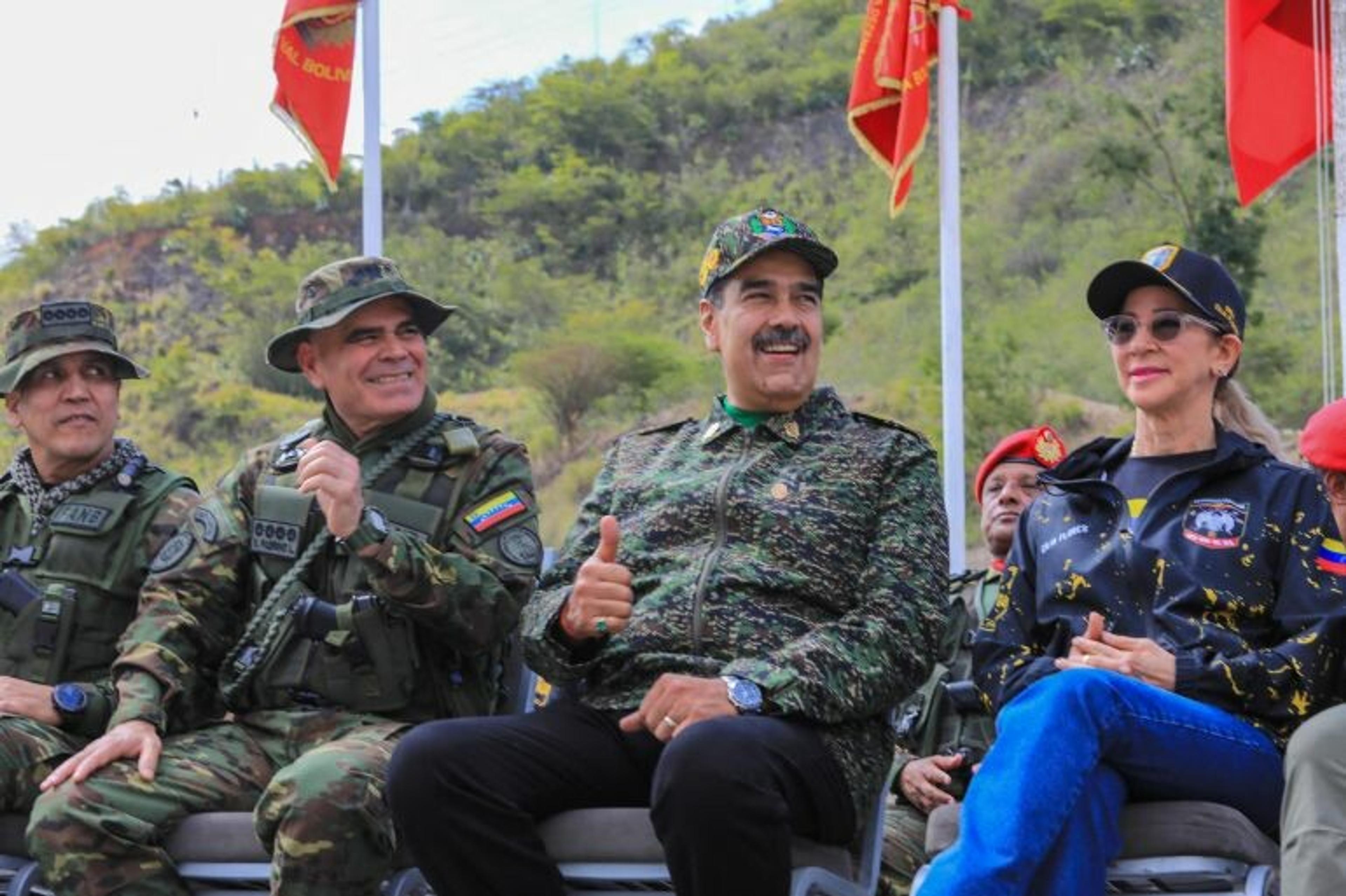 Nicolas Maduro and his wife watching military training in Caracas