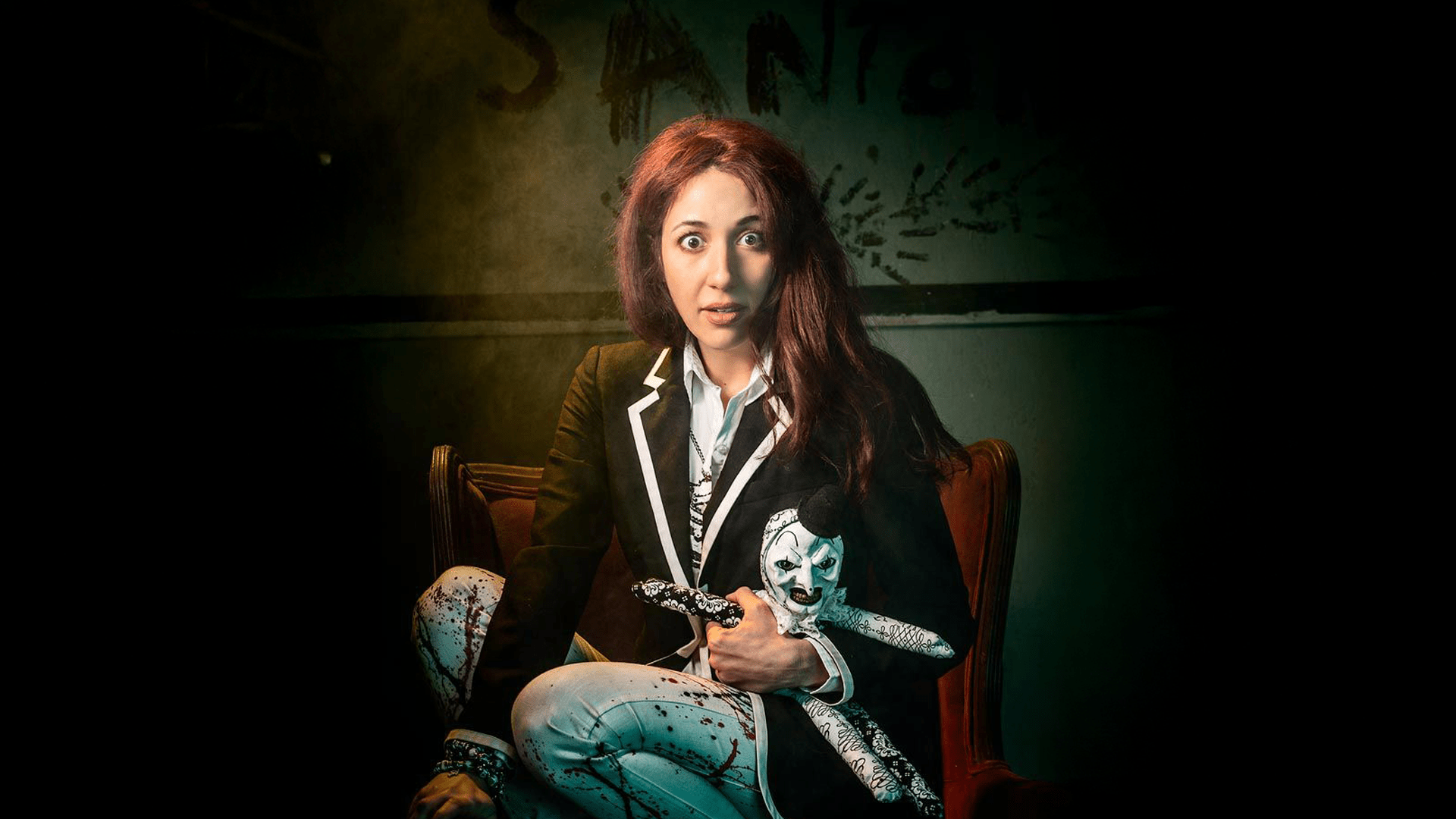 olga turkan and terrifier in front of a house