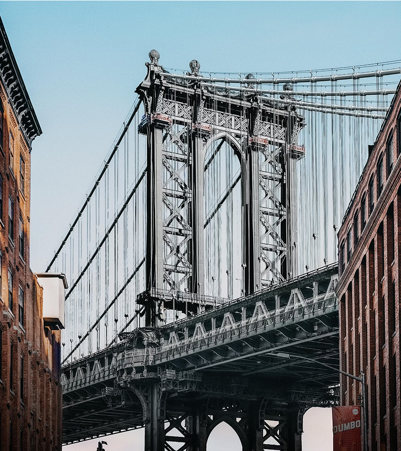 a bridge with a dumbo sign hanging from it