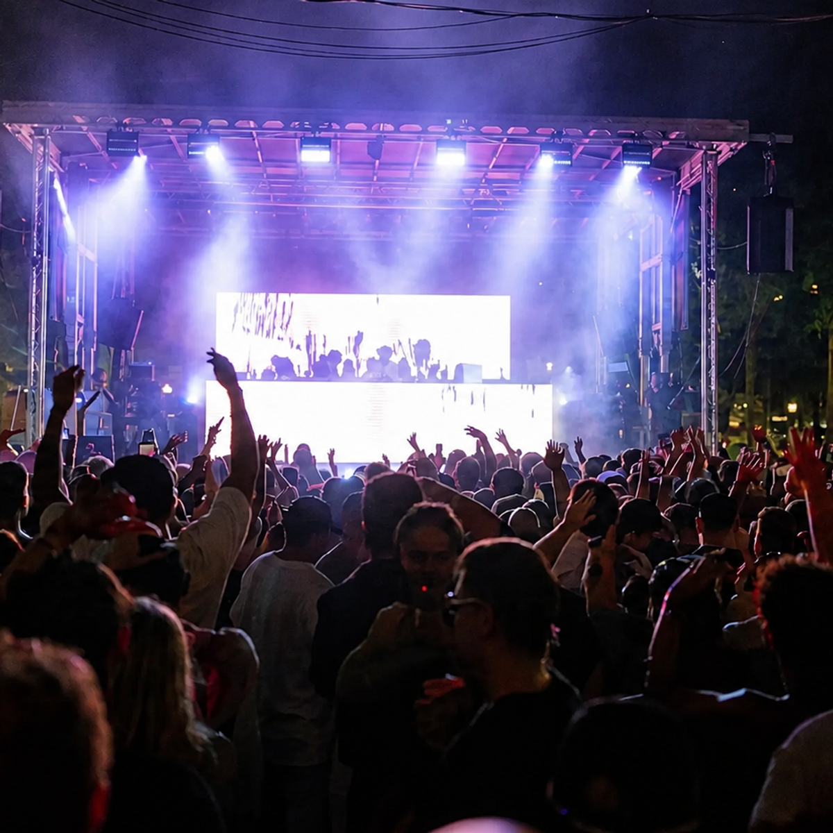 Mobile stage and LED video wall — large outdoor festival crowd