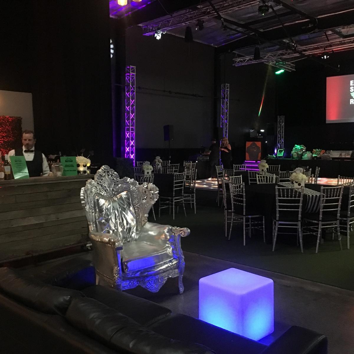Lounge setup with mobile bar and LED cube seating