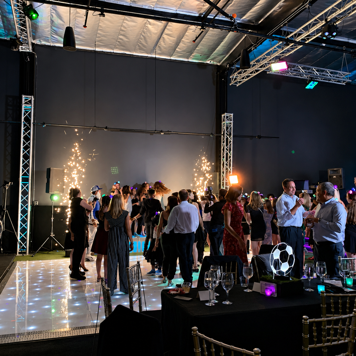 Cold spark effects and LED dance floor — soccer-themed celebration