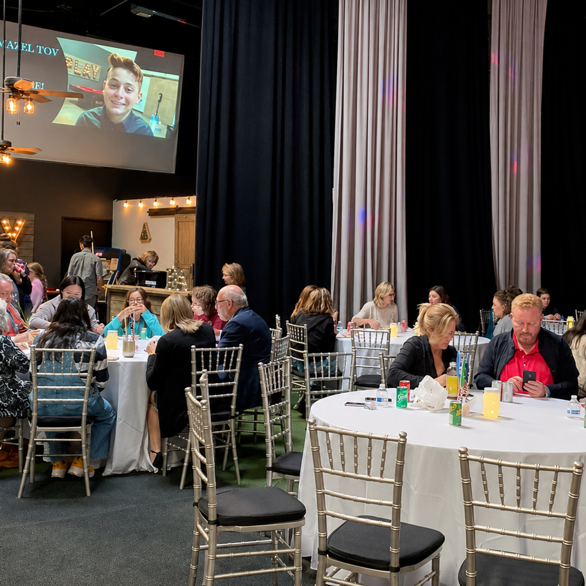 Bar mitzvah celebration with lounge games and round table seating