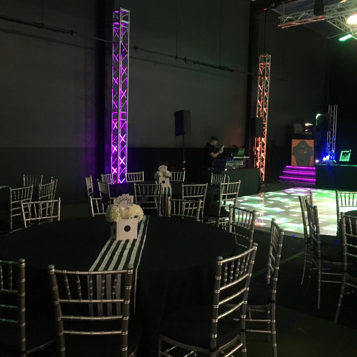 Casino night with a color-changing dance floor and DJ booth