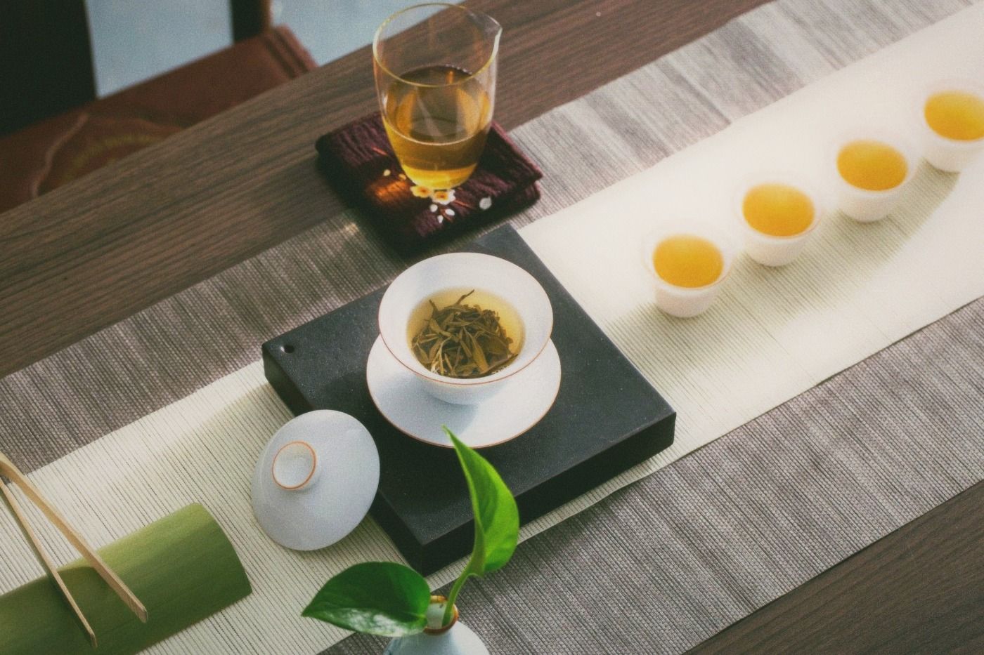 A traditional gongfu tea set arranged on a simple wooden surface