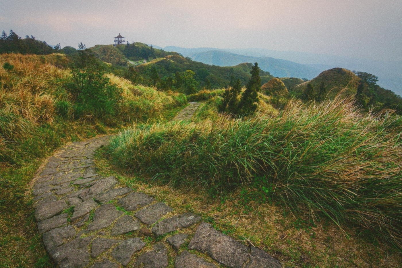Qixing Mountain summit trail with stone steps and mountain views