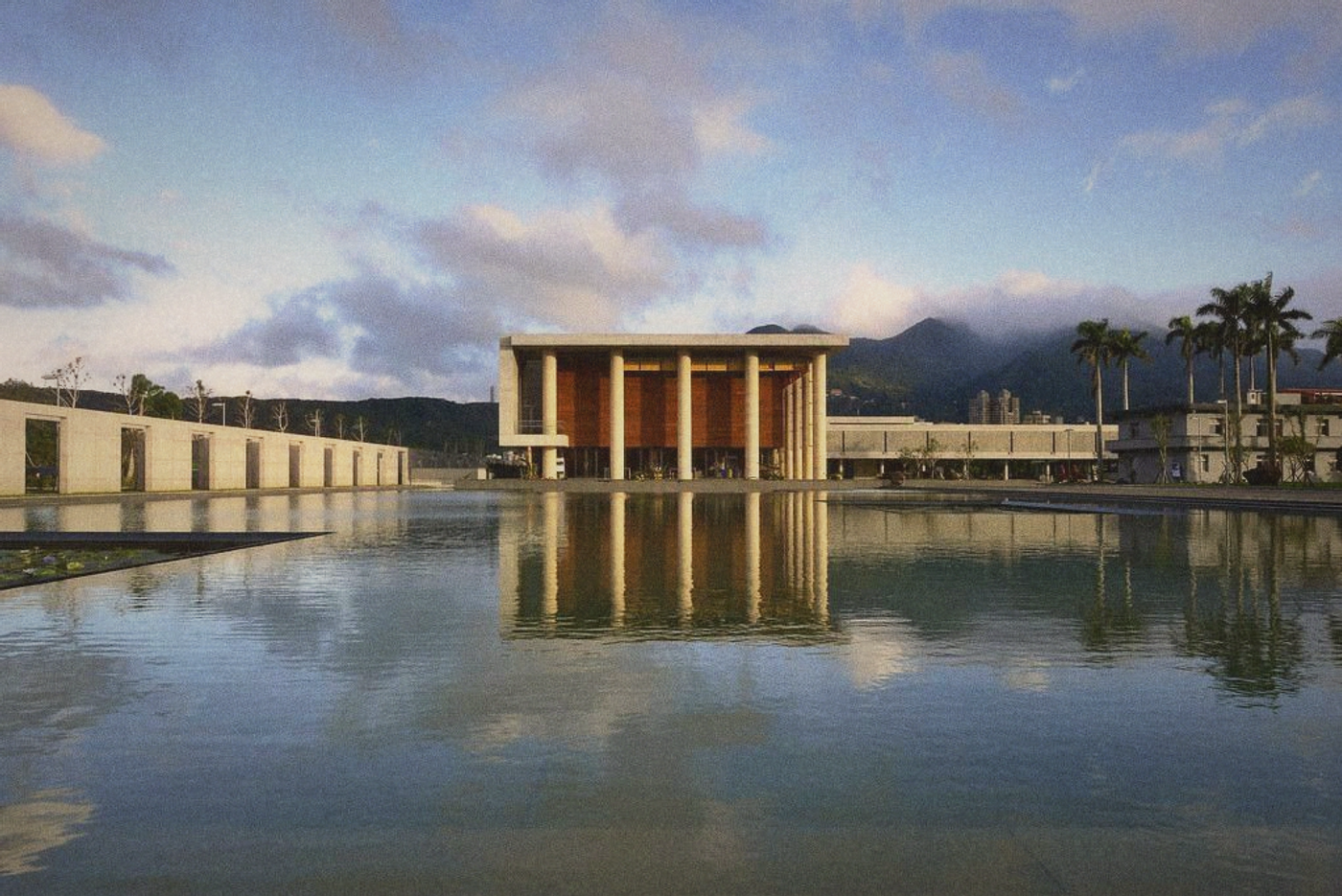A quiet temple courtyard in the early morning, stone and water, soft light