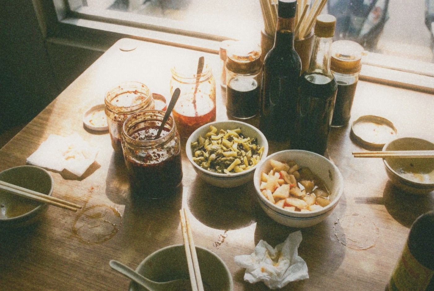 Close-up of condiment table at a Taiwanese beef noodle shop