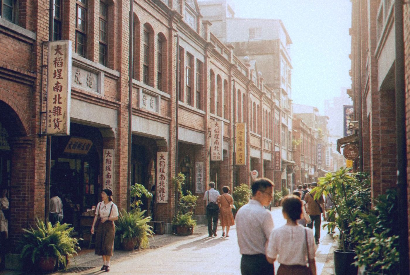 Historic Dadaocheng street in Taipei with restored red brick shophouses