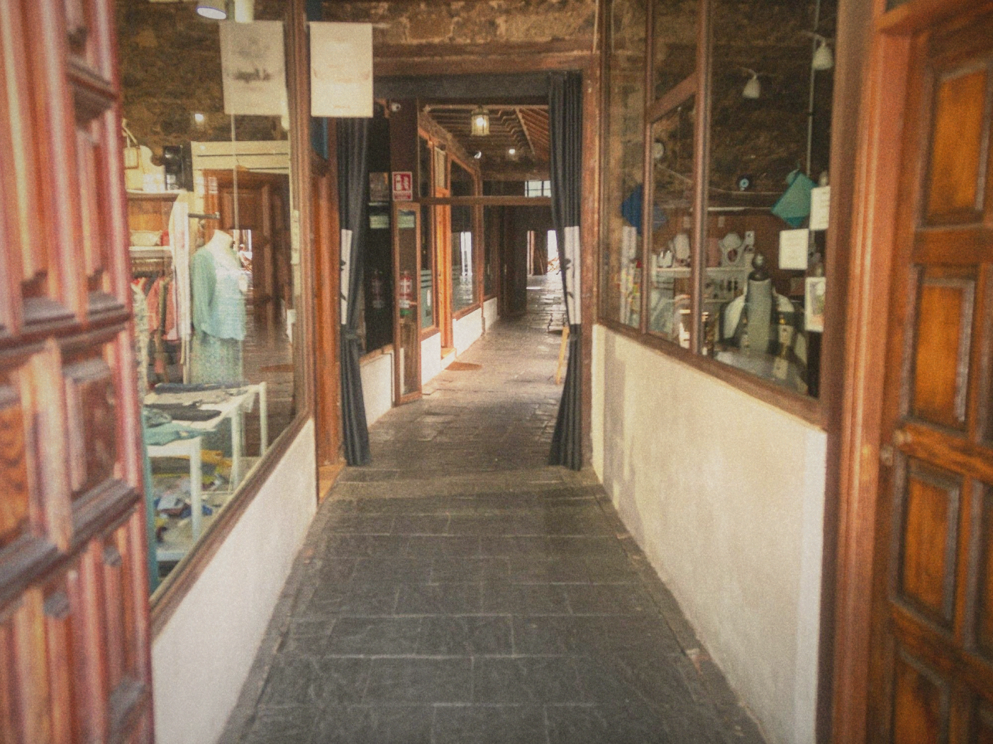 The storefront of an independent fashion boutique on a quiet Taipei side street