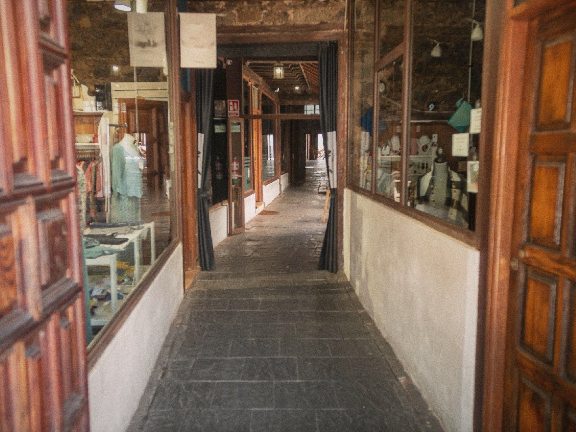The storefront of an independent fashion boutique on a quiet Taipei side street