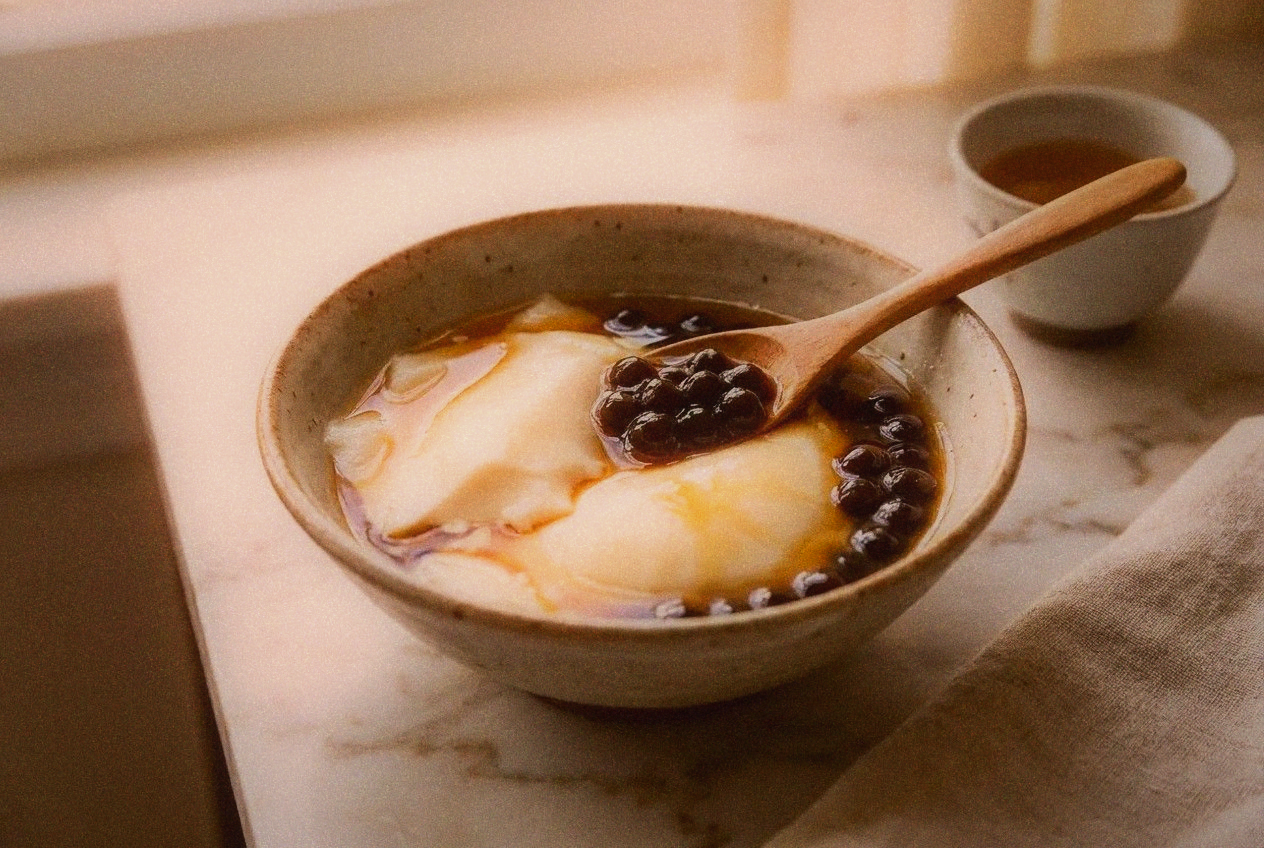 Traditional Taiwanese douhua tofu pudding with sweet ginger syrup and tapioca balls