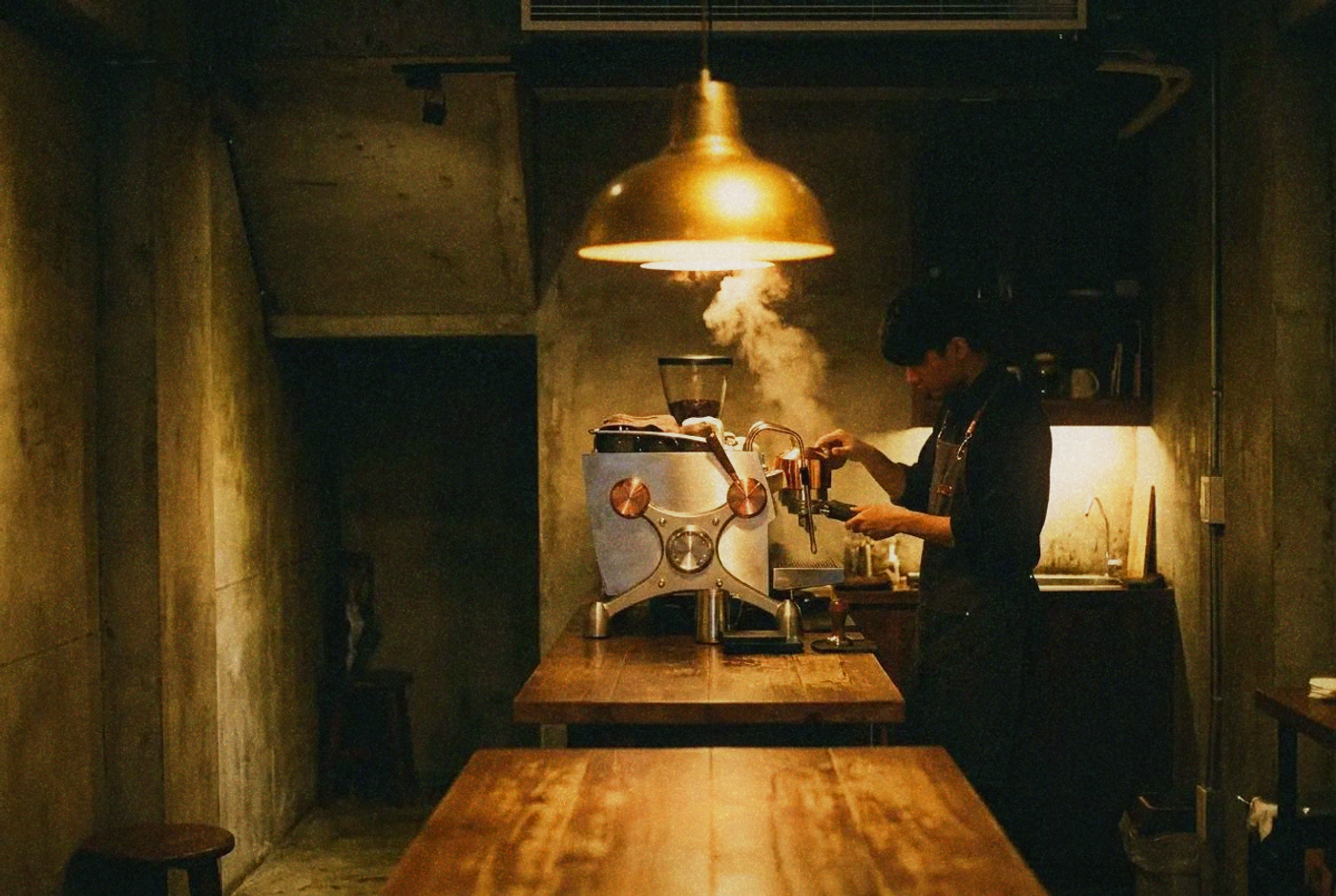 Moody basement coffee shop interior in Taipei with espresso machine