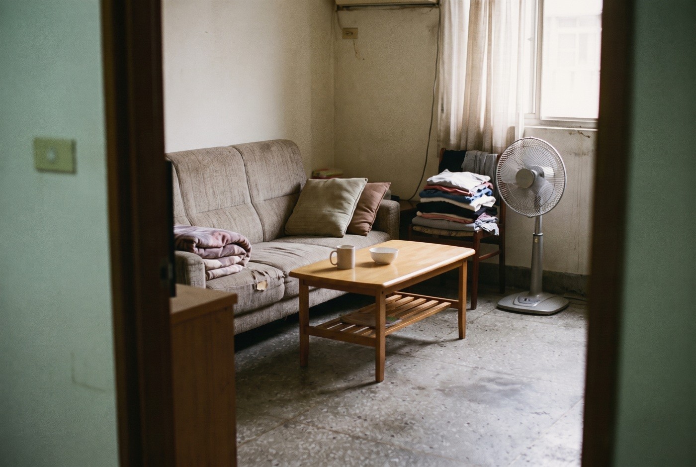 Illustration: A compact apartment sitting room.