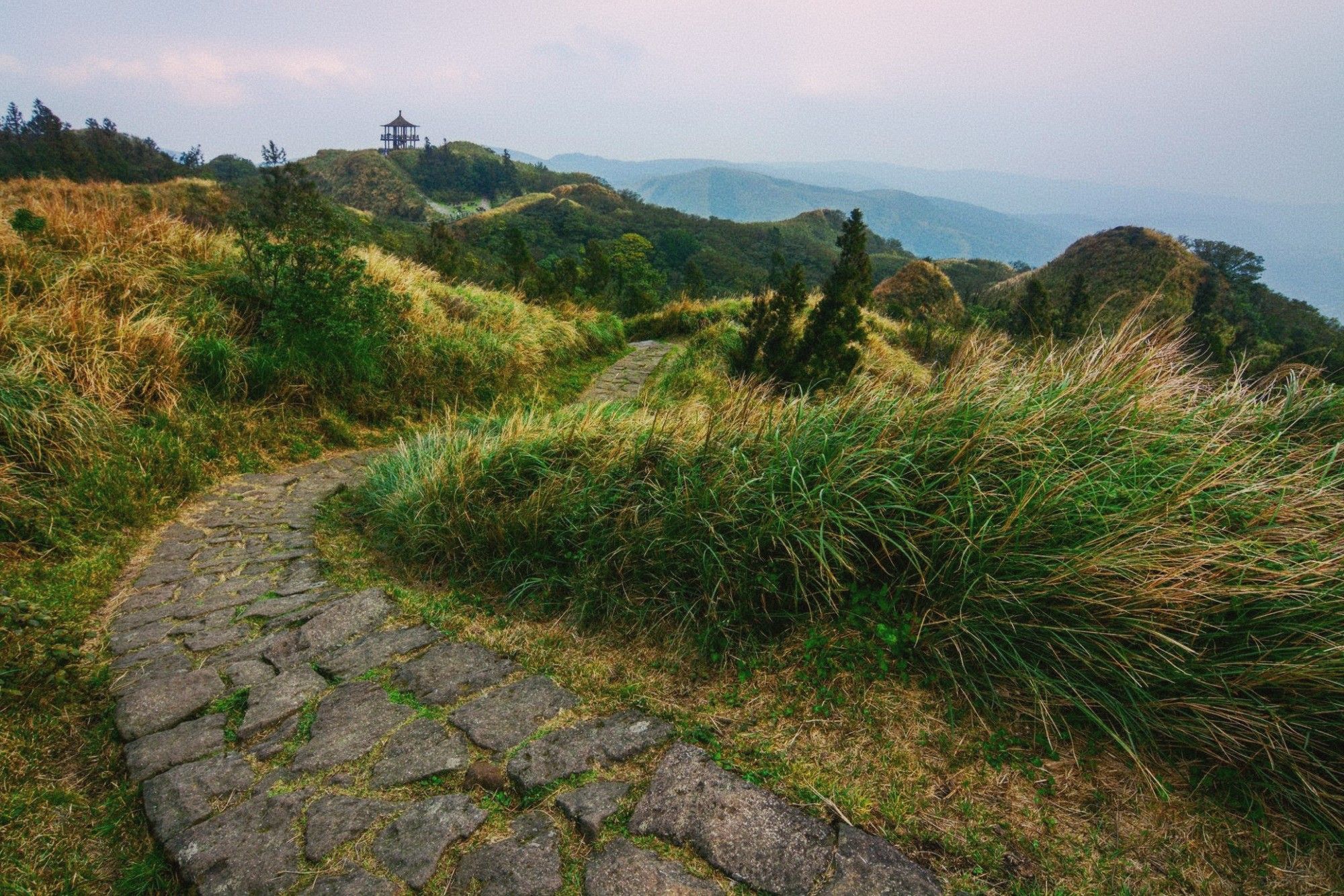 Qixing Mountain summit trail with stone steps and mountain views