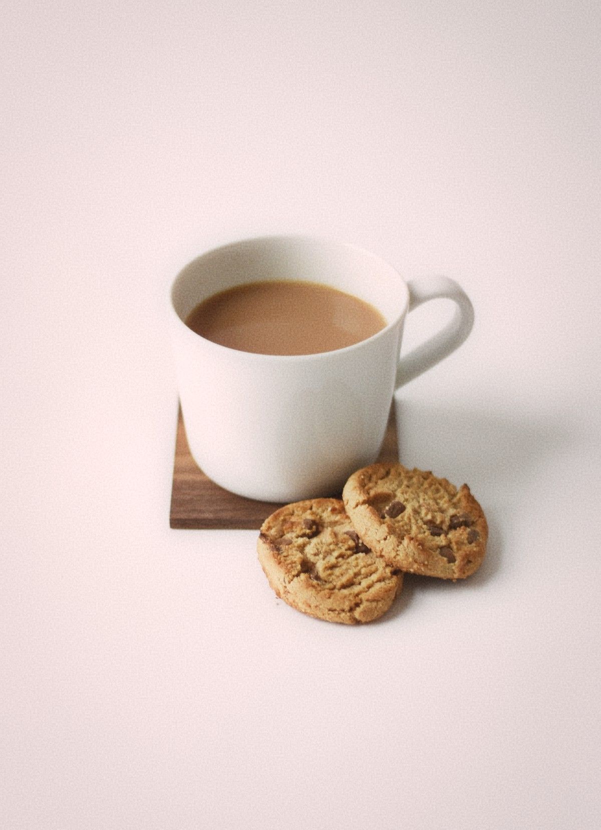 Herbal tea cup on wooden bedside table