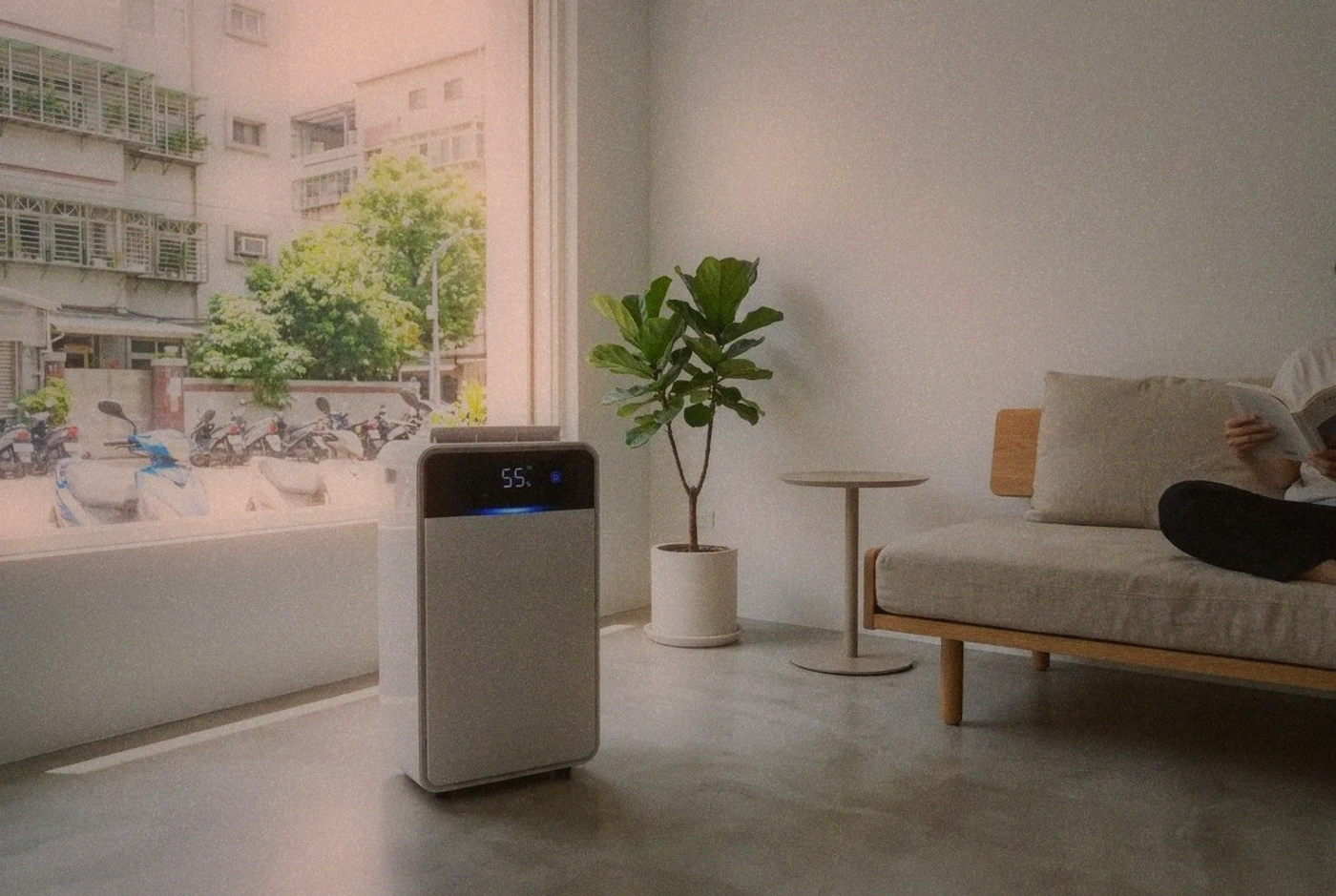 Modern dehumidifier running in a small Taipei apartment living room