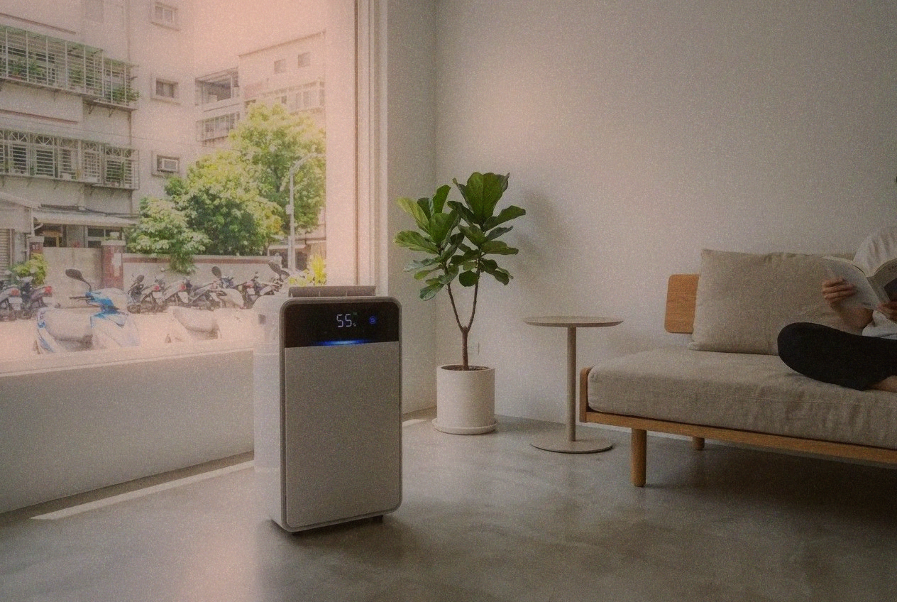 Modern dehumidifier running in a small Taipei apartment living room