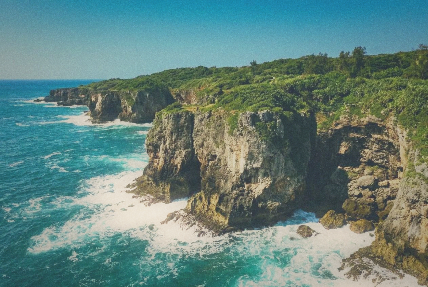 Dramatic coral rock formations along the Kenting coastline with turquoise sea
