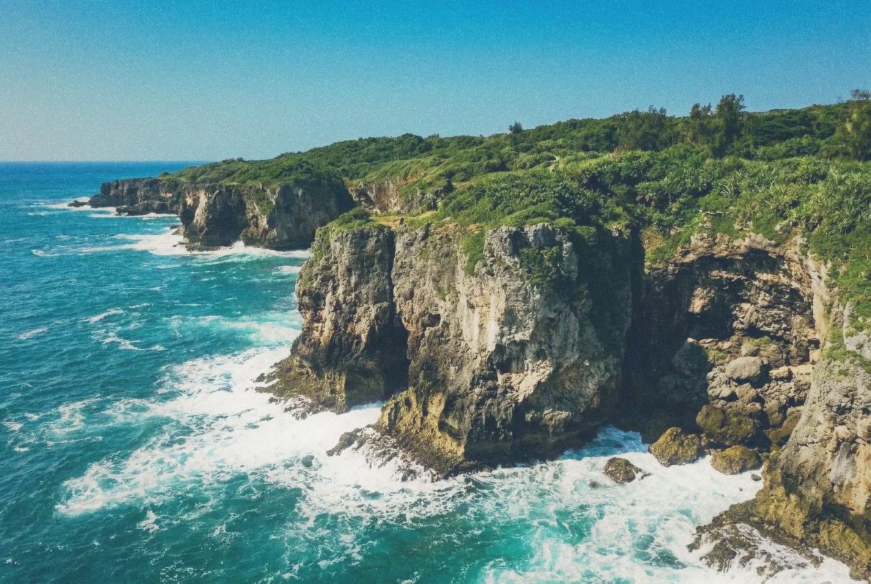 Dramatic coral rock formations along the Kenting coastline with turquoise sea