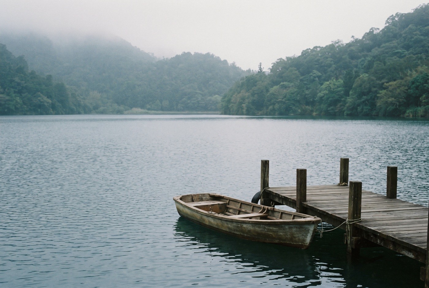 Illustration: A small boat tied beside a wooden jetty.