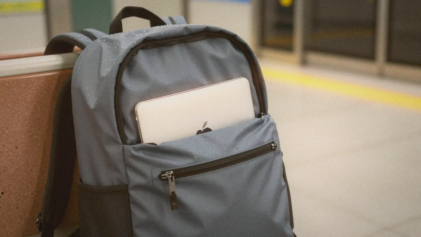 Close-up of a waterproof backpack with rain droplets beading on its surface