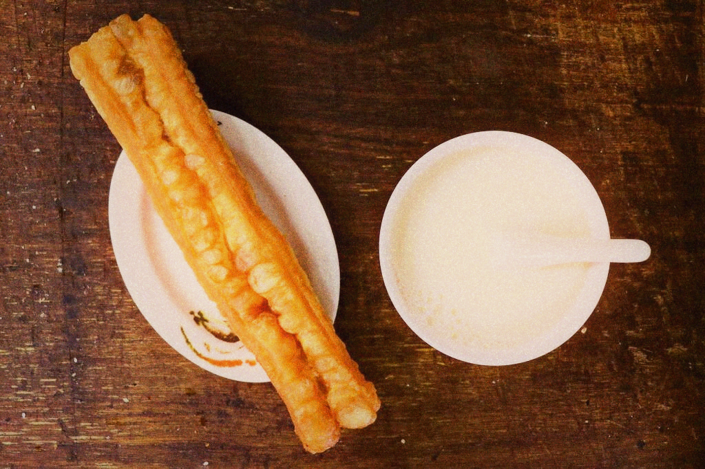 Traditional Taiwanese breakfast spread with soy milk and shaobing