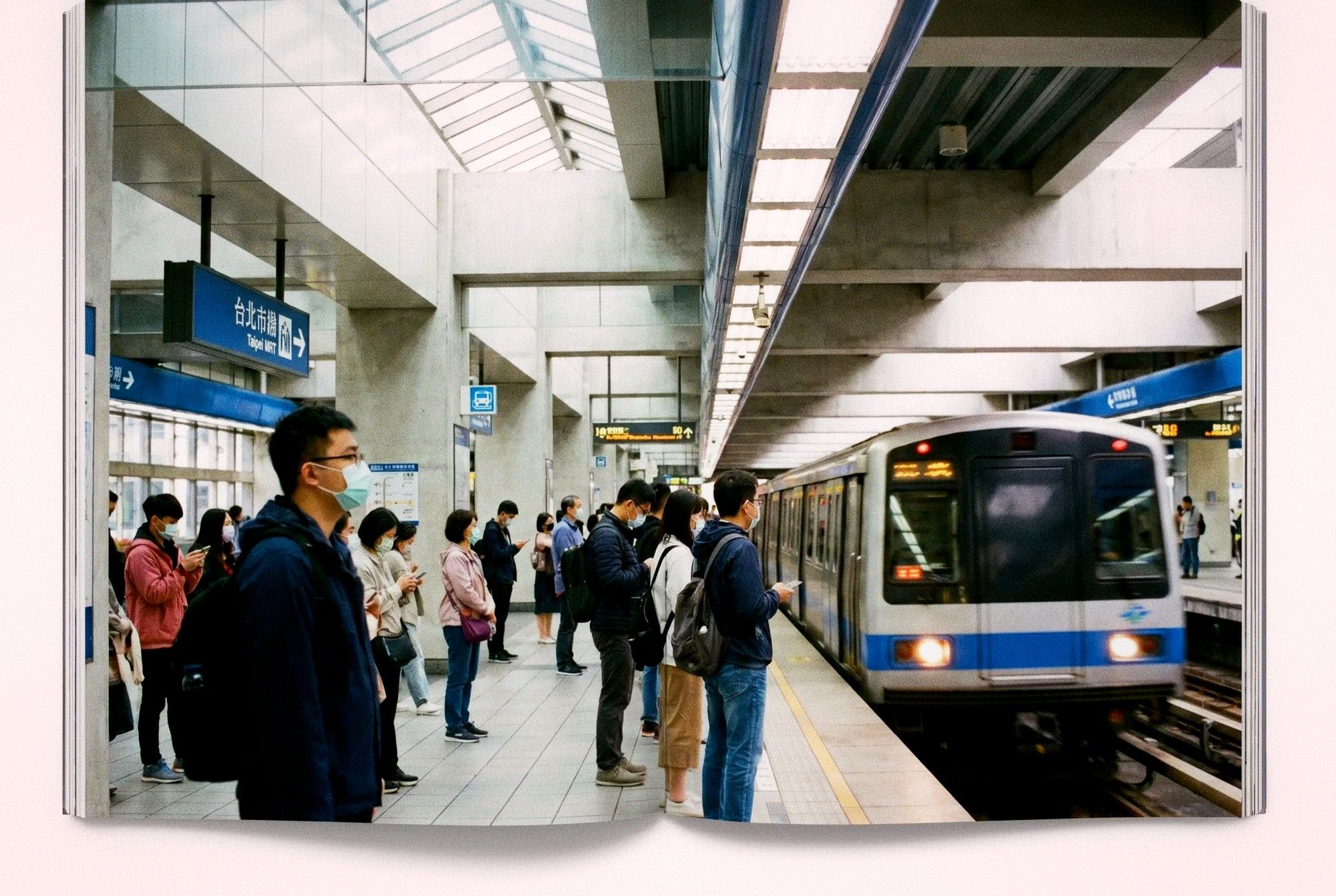 Taipei MRT station platform with commuters waiting