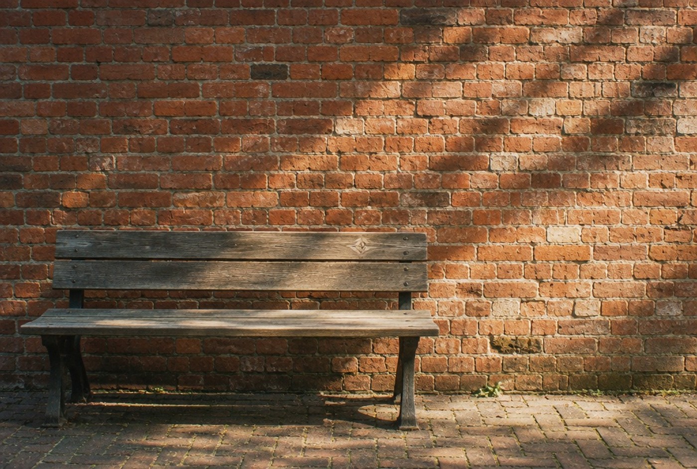 Illustration: A pause beside old brickwork, not a named venue.