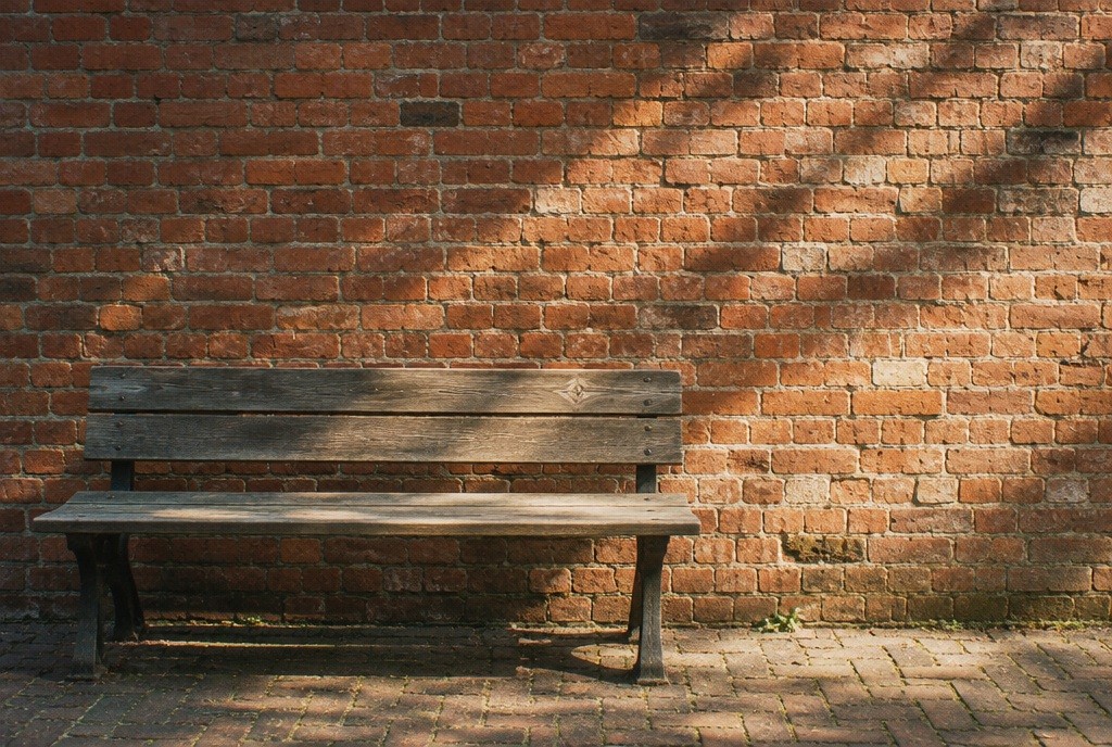 Illustration: A pause beside old brickwork, not a named venue.