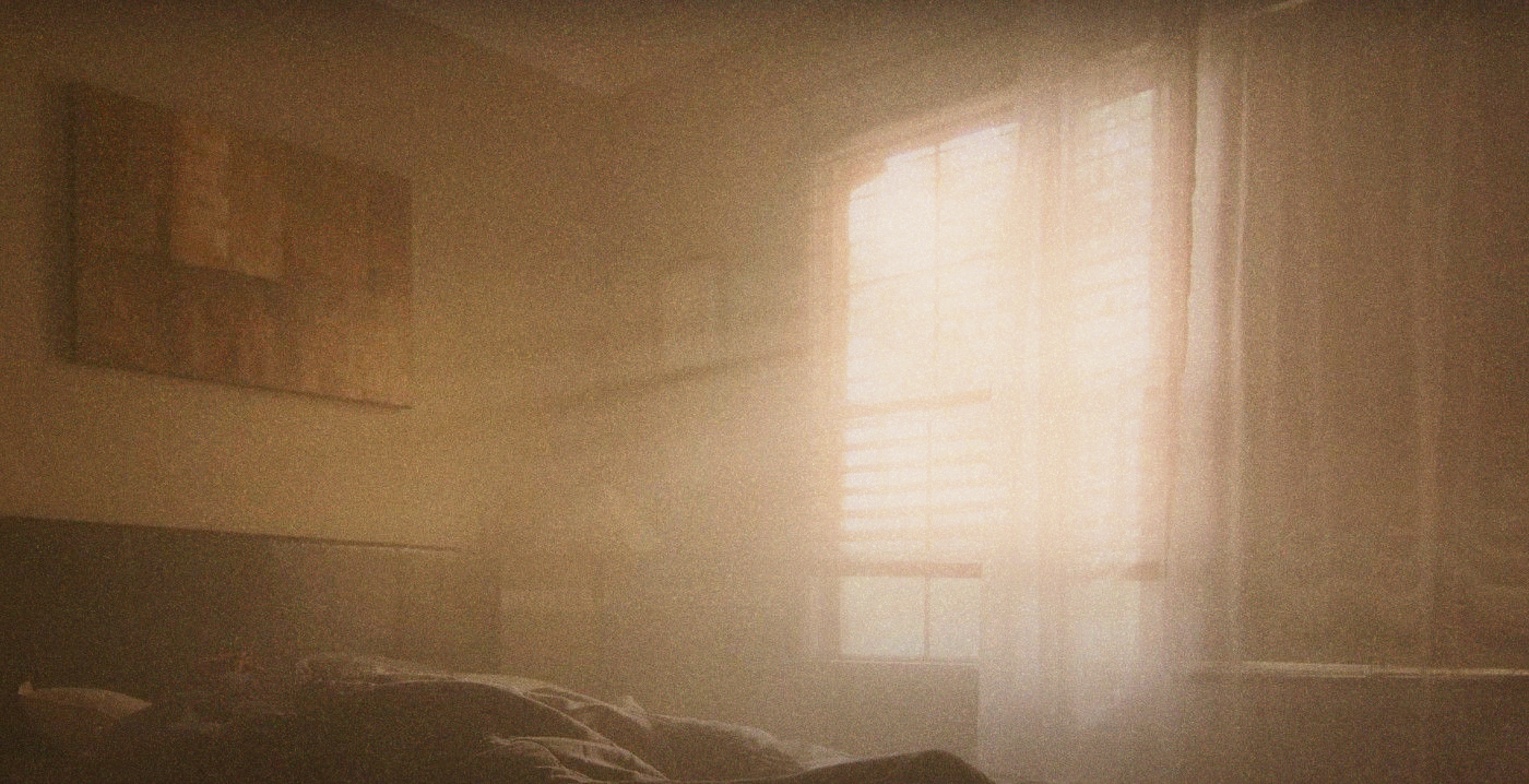 Hazy sunlight flooding a bedroom through sheer curtains and blinds, bedding in the foreground