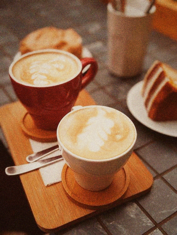 Minimalist coffee bar with barista preparing pour-over