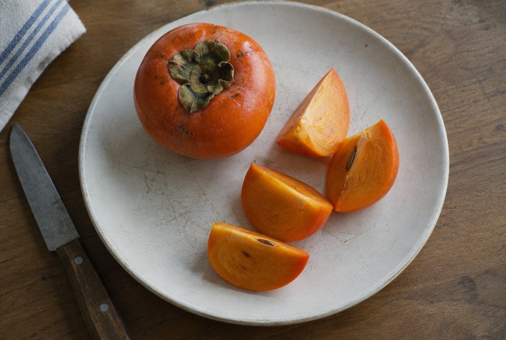 Illustration: Persimmon wedges ready for the table.