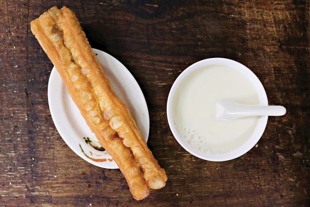 Traditional Taiwanese breakfast spread with soy milk and shaobing