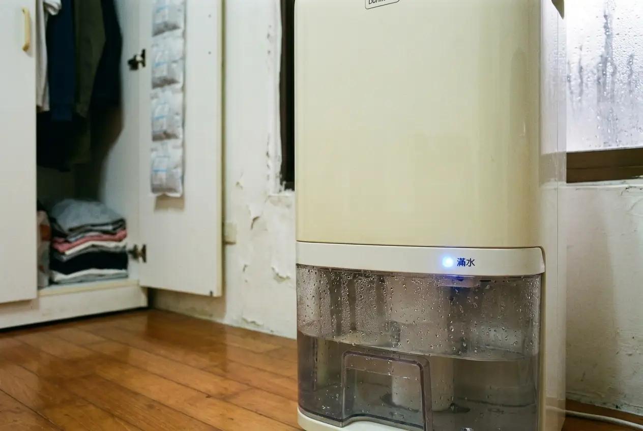 Dehumidifier running in a Taipei apartment with humidity reading display